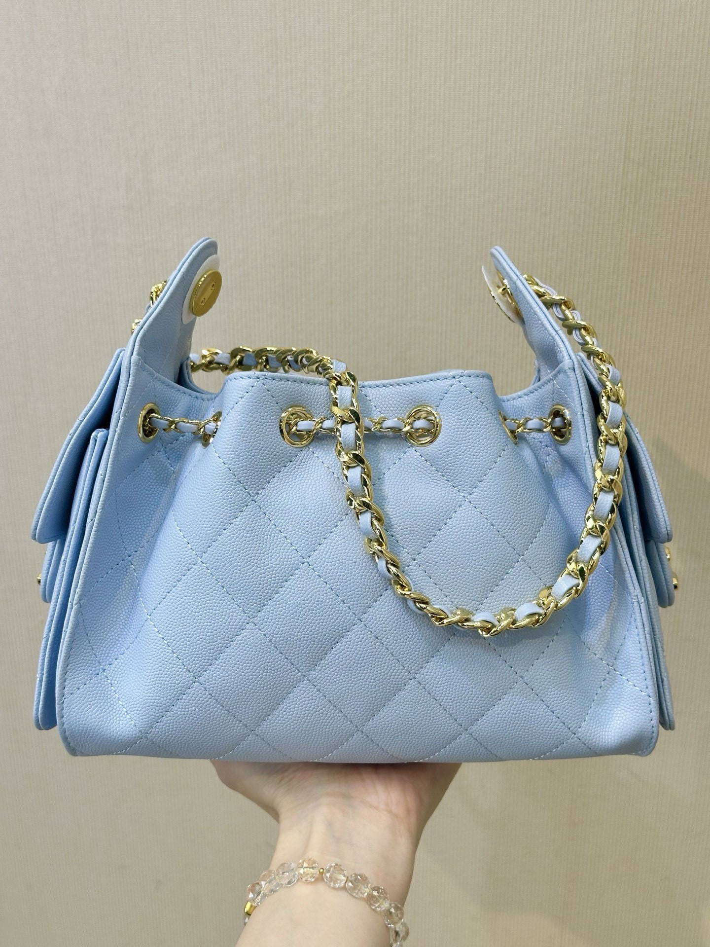New light blue quilted chain bucket bag for women, perfect for shoulder, crossbody, or hand carry. A must-have for work or dates, a versatile go-