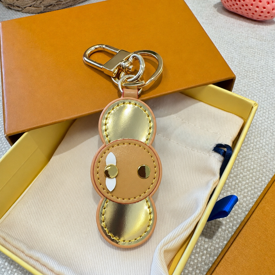 Porte-clés de styliste pour hommes et femmes, pendentif de sac de luxe, accessoires de mode, ornement classique, lanières de bonbons pour Couple
