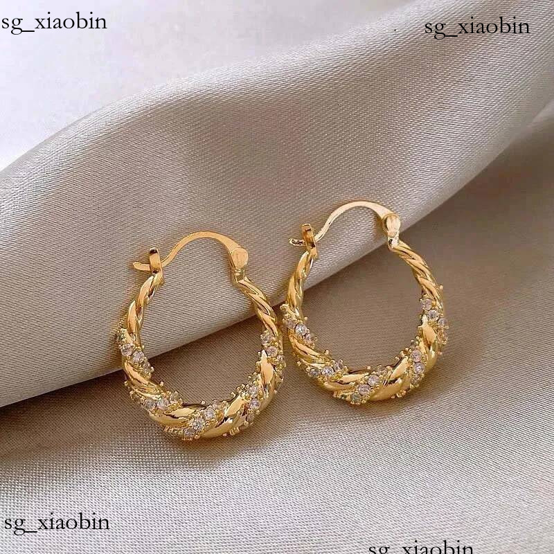 Boucles d'oreilles torsadées en Zircon brillant pour femmes, couleur or, accessoires d'oreille géométriques en forme de U, bijoux de fête, tendan