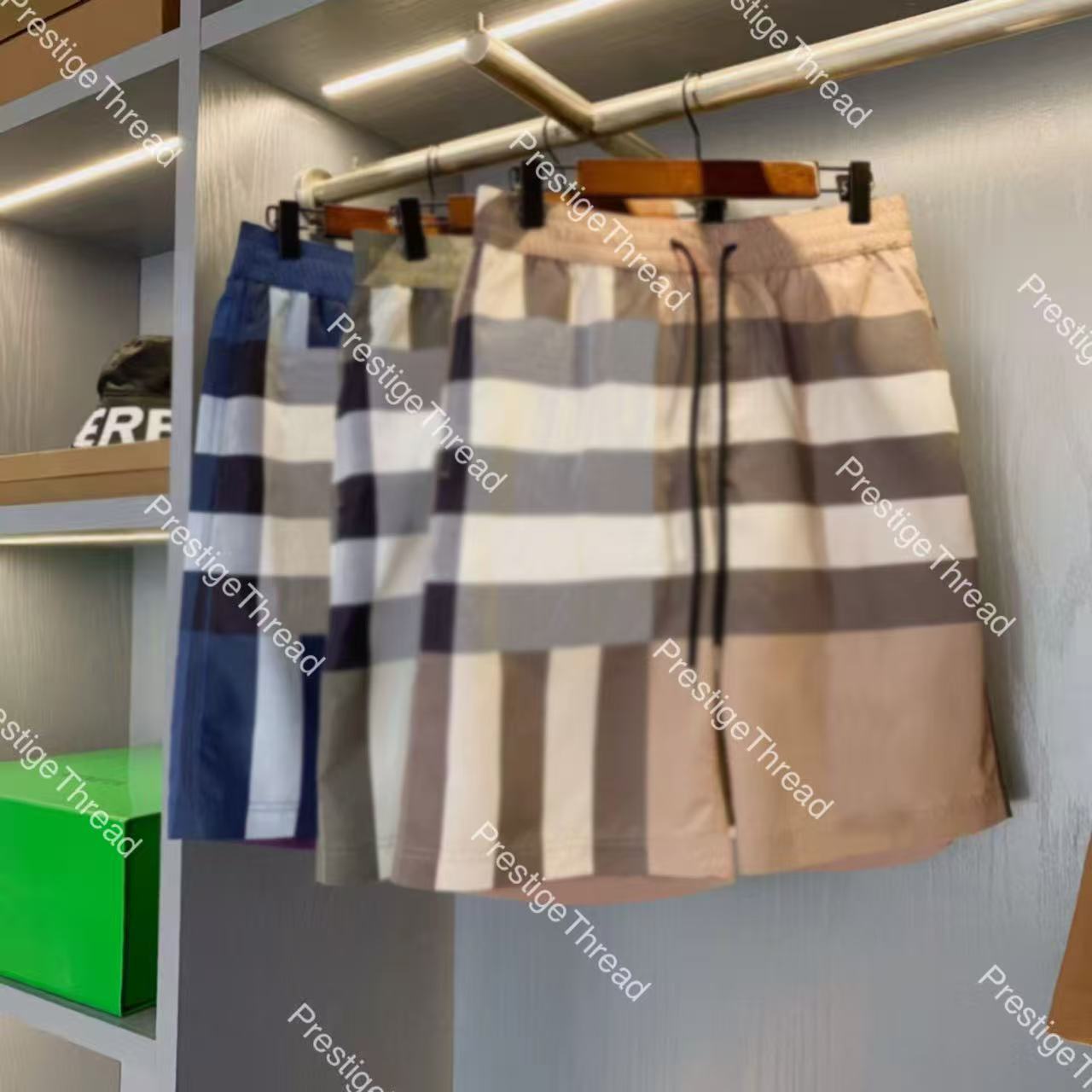 Designer men's shorts with large check pattern and drawstring swim trunks, 2026 new casual beach quick-dry five-point shorts