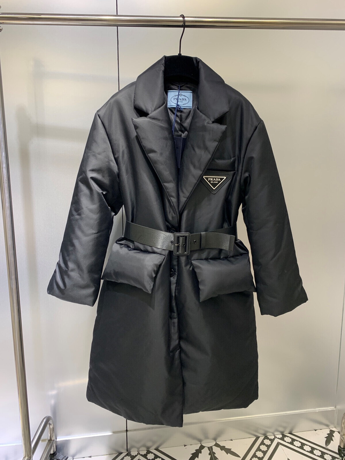 12A New hooded down jacket with letter Velcro cuffs featuring classic inverted triangle logo embellishment and adjustable waistband