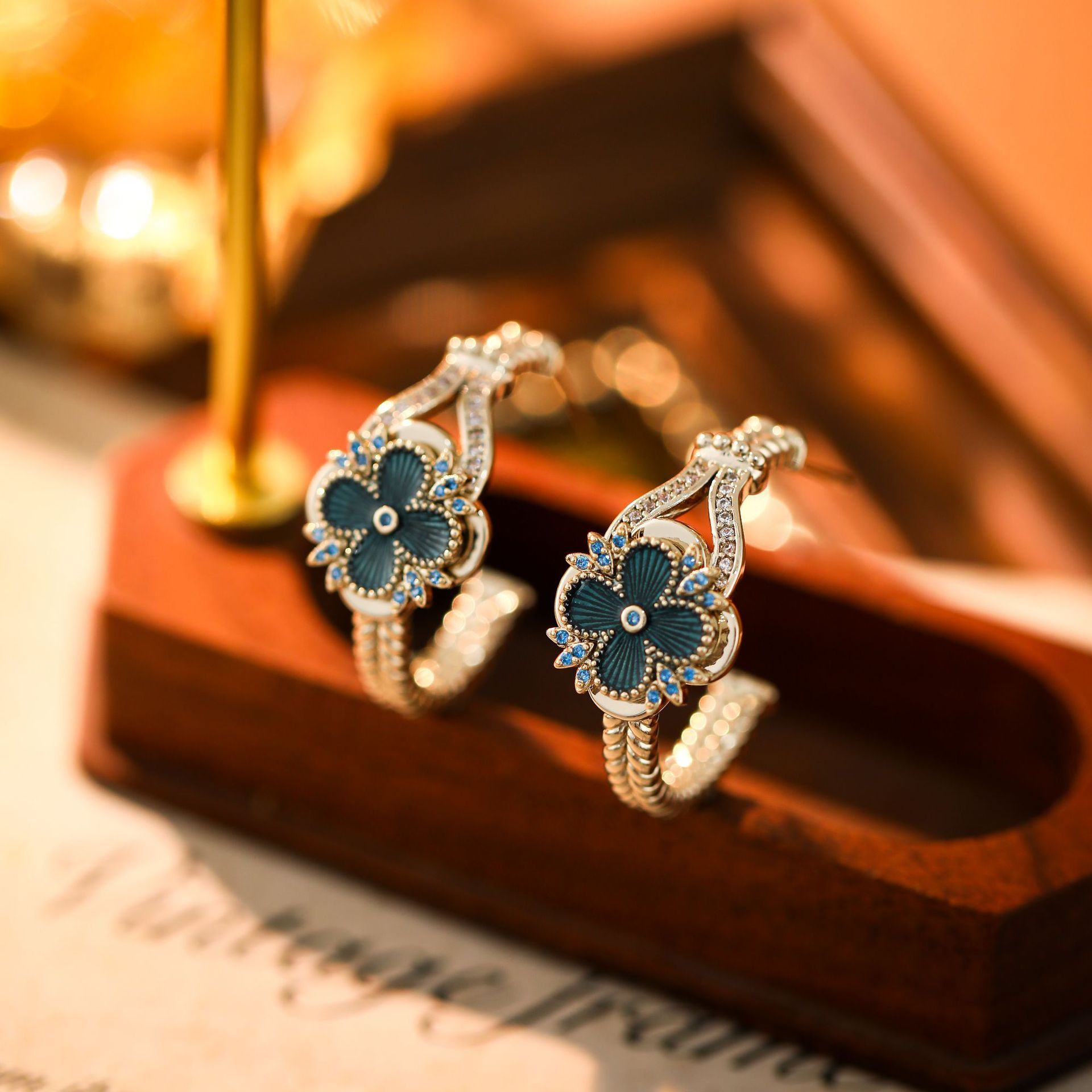 Blue zircon flower stud earrings, featuring diamond accents, luxurious stylish design women, with a unique elegant aesthetic, and versatile for any
