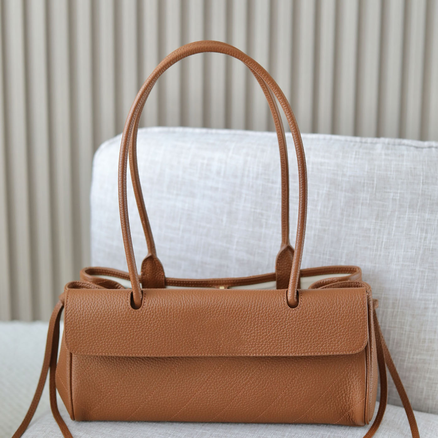 Designer Bag 26S series pebbled leather baguette shoulder handbag long top handle for dating party outing
