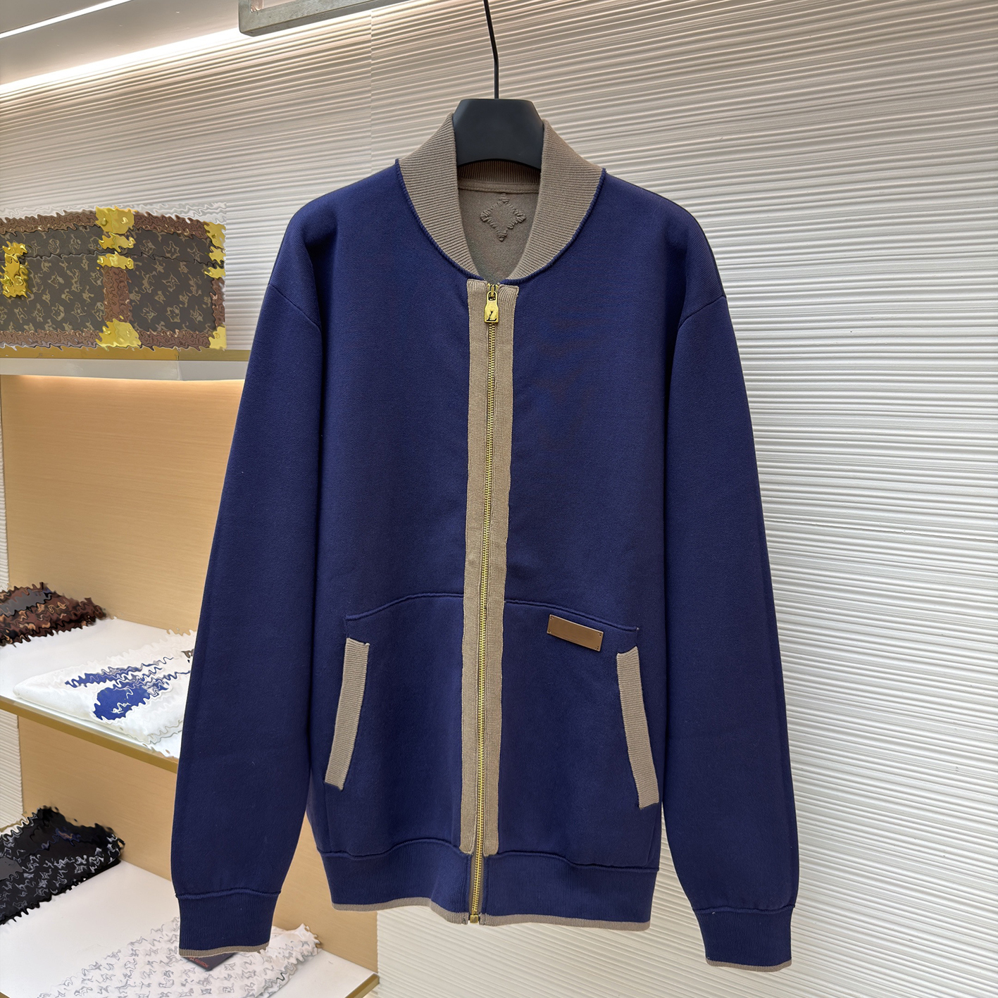 Designer branded clothing includes high-quality men's contrasting baseball jerseys, color blocked zippered hoodies, cardigans, and casual loose