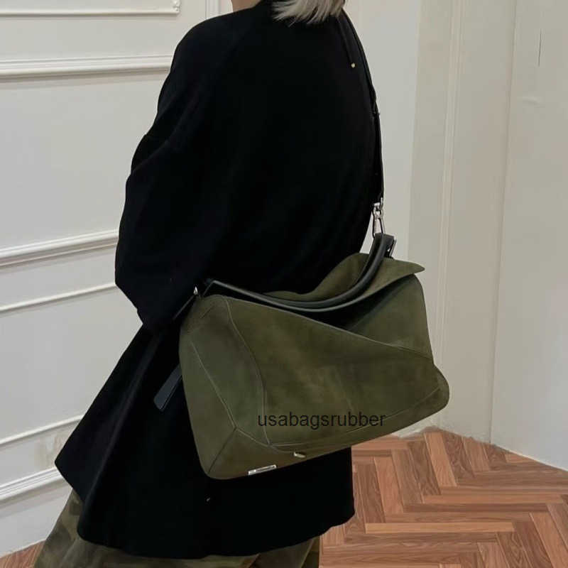 Modern Designer Style suede geometric patchwork bag a high end lightweight and luxurious leather handbag a casual and stylish shoulder bag or crossb