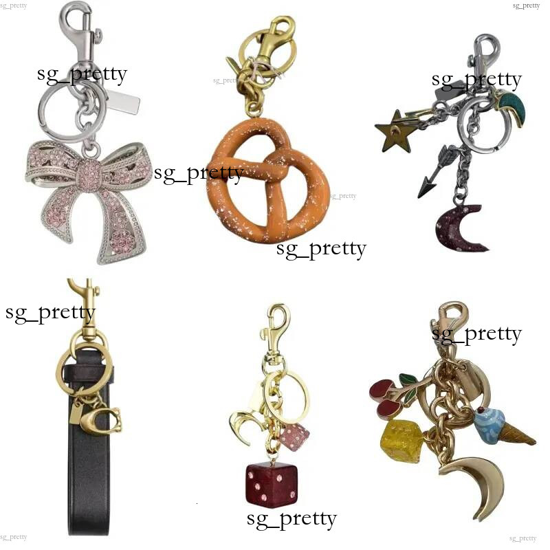 2026Exquisite bag charms keyring simple keychain wallet letters strawberry key buckle womens designer purse charm pendant sh0297Best Sellers