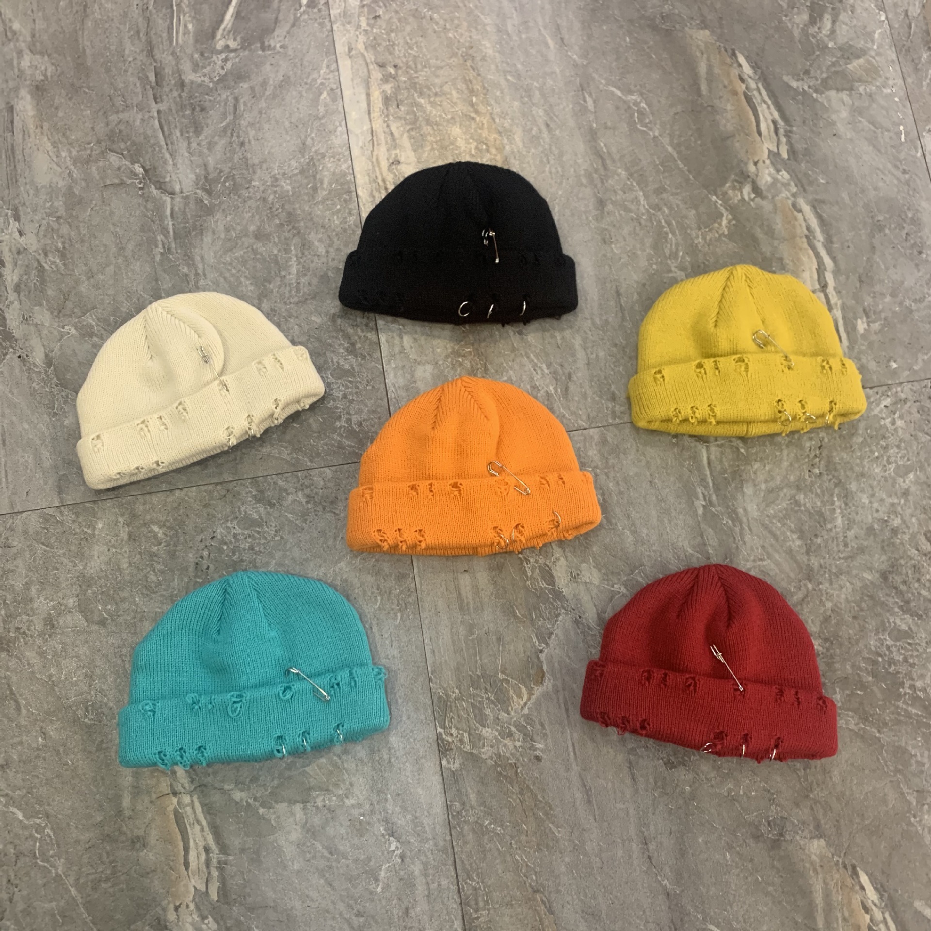 Women's autumn winter warm, stylish, unique beanie with a pin detail distressed design; men's fashionable versatile knit hat for clubbing