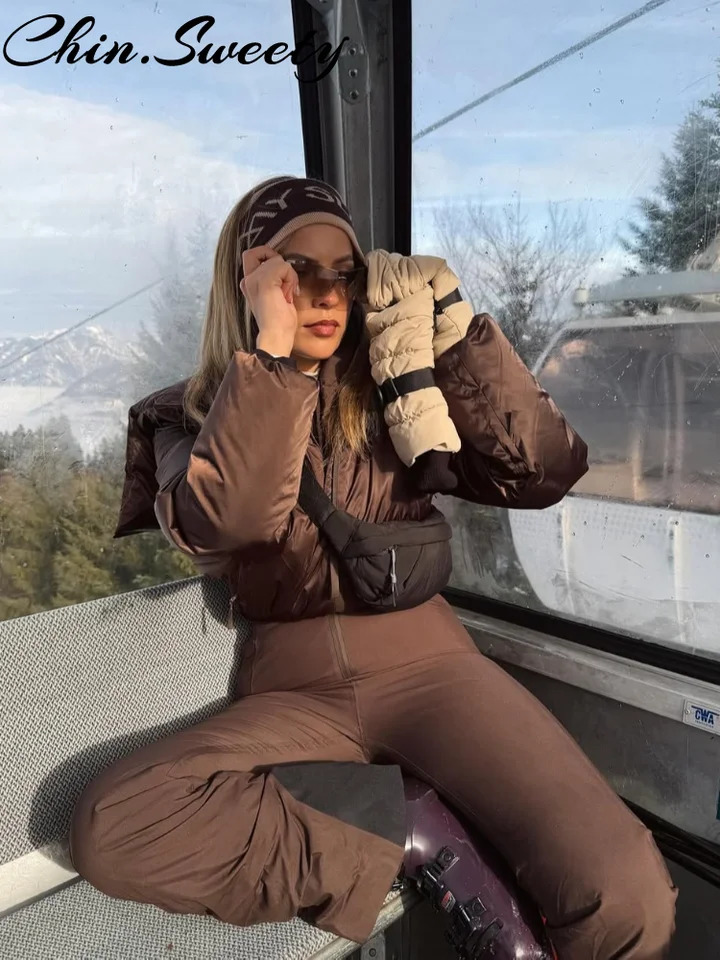 2026 Winter Hooded Womens Ski Jumpsuits Street Zippers Warm WaistClosed Belt Thicken Female Rompers Fashion Lady Skiwear 261016