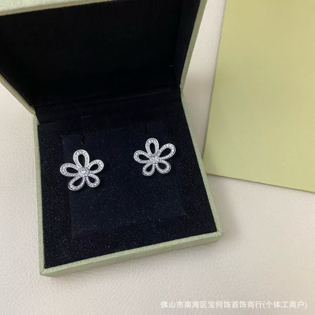 Designer Jewelry vanly sterling silver earrings, plated white gold, featuring a large flower design and fully encrusted with diamonds