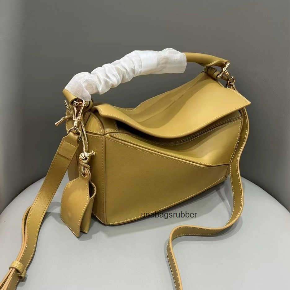 Modern Designer Style High Version New Version Pendant Geometric Bag Irregular Splicing Pillow Bag Leather Handheld Crossbody Bag