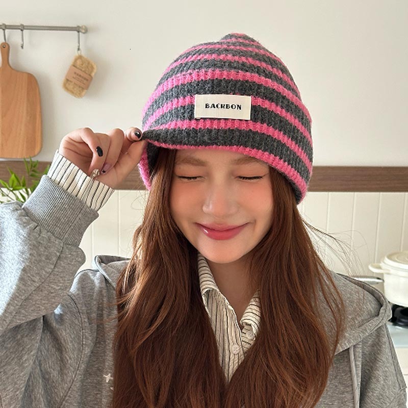 Koreanstyle striped colorblock knitted hat women versatile fashionable for autumn winter warm faceslimming and earprotecting with a fluffy oversized