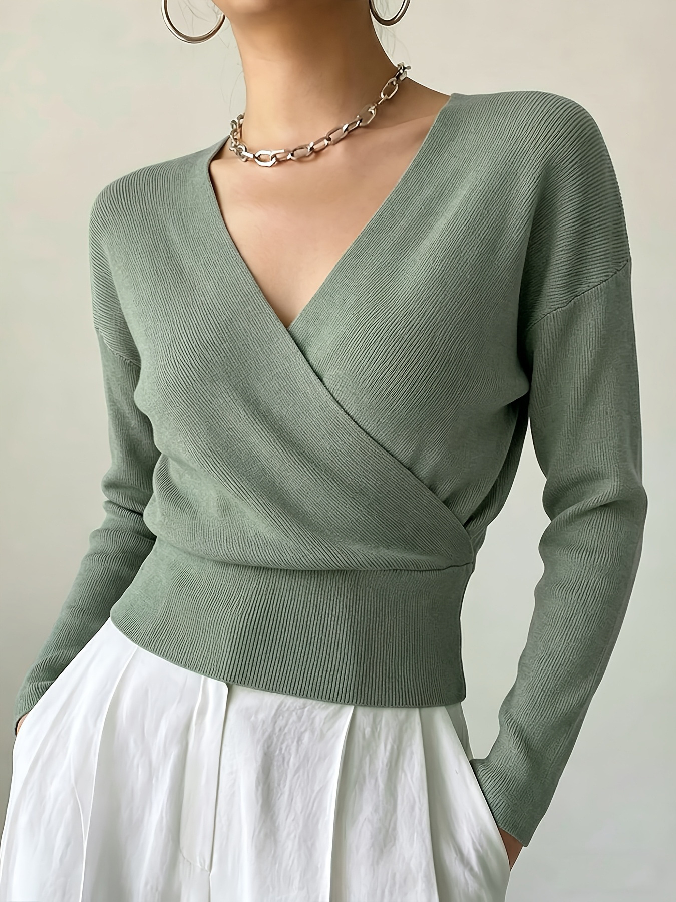 2026 New Designer European And American Style Women's Knitted Sweater Long Sleeve Solid Color Fashion Cross Collar Waist Design Bottom Coat