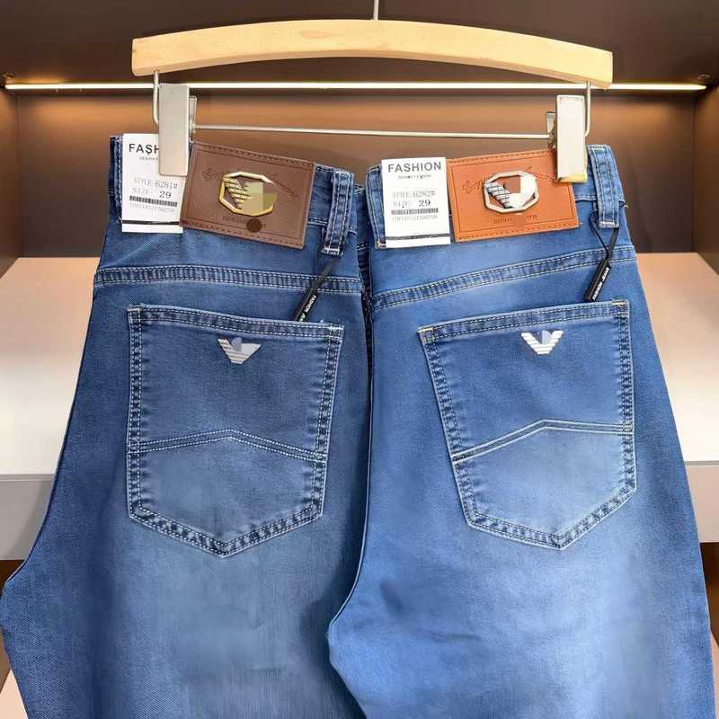 designer Men's Jeans classic Eagle brand offers slim-fit, stretchy, blue-washed, straight-leg men jeans SCUM