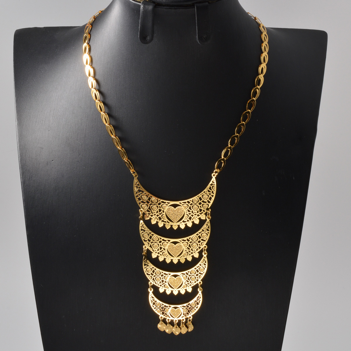Bohemian retro crescent-shaped filigree necklace with intricate floral patterns and heart motifs