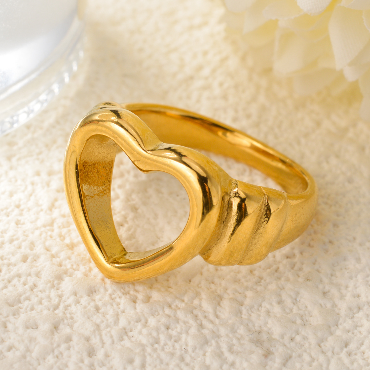 Light luxury, niche French-style accessories: hollow heart-shaped, twisted titanium steel with gold plating, creating a romantic atmosphere; women&#