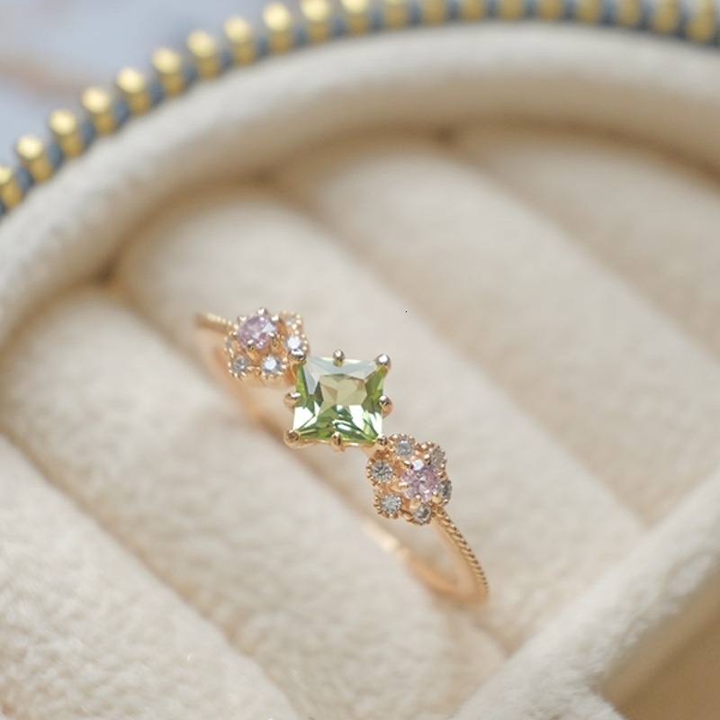 -style, delicate and sweet, gold-plated pink flower ring with a green peridot square-cut stone