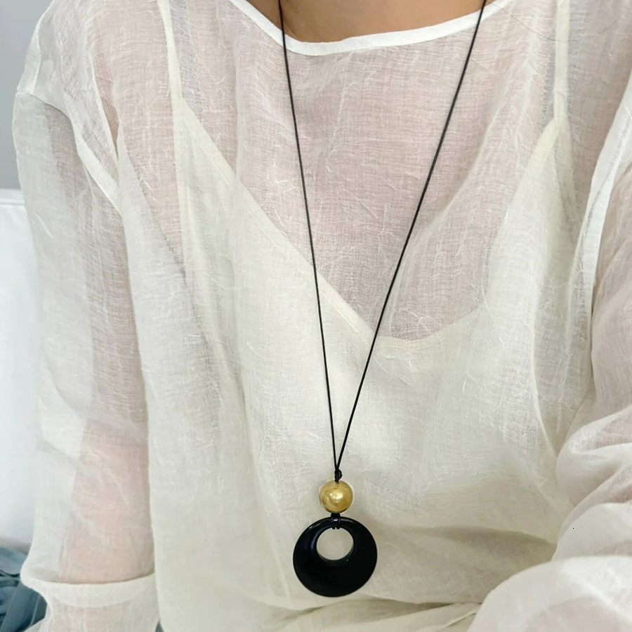 Trendy black cord and obsidian ring long necklace, unique design, oval pendant, sweater chain, high-end accessory