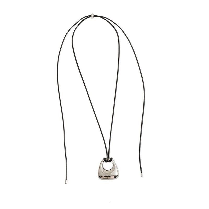 Korean Dongdaemun silver brushed bag pendant necklace for women, high-end black cord pull sweater chain, 2025 new style