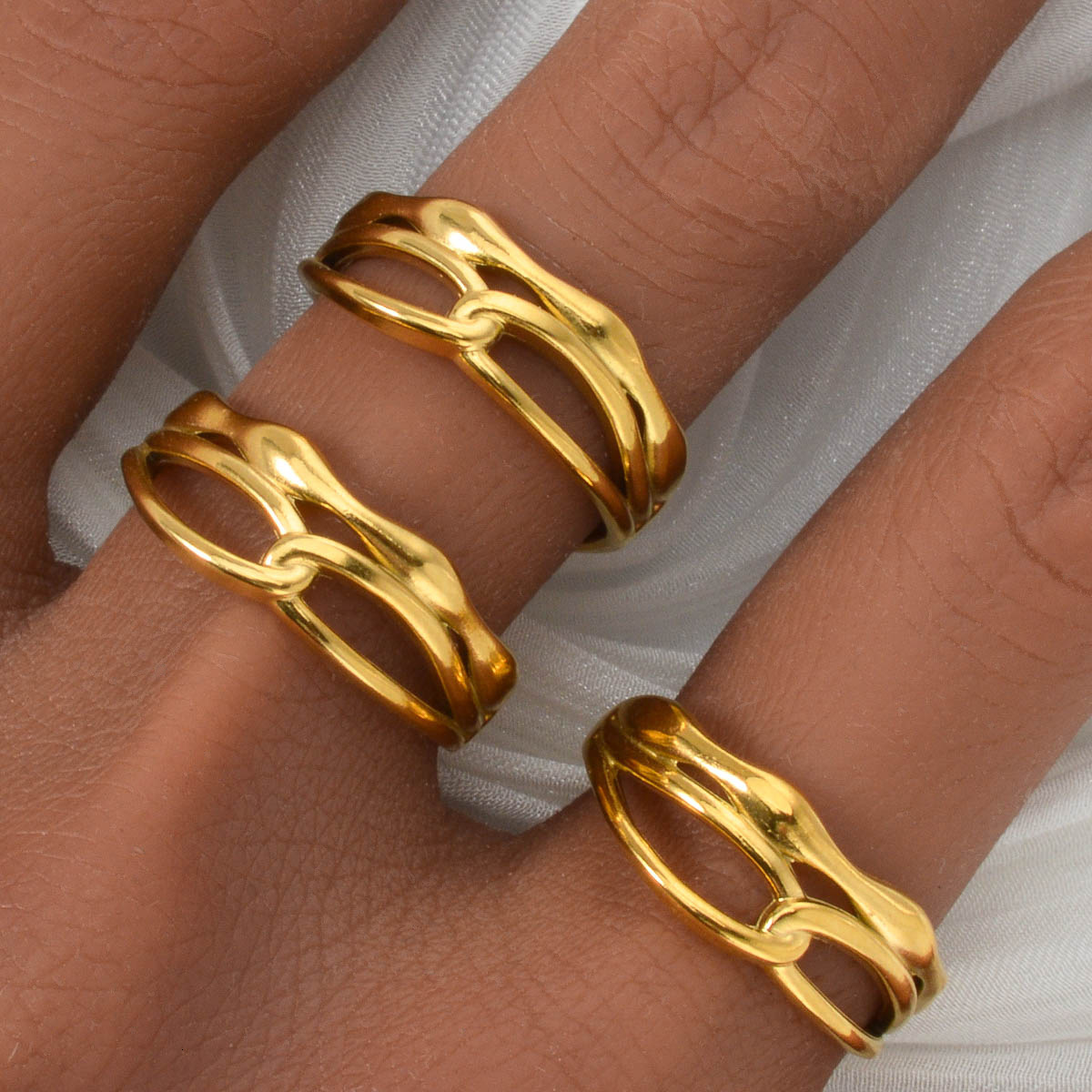 European American-style, Instagram-inspired, subtly luxurious stainless steel ring with interwoven, asymmetrical lines, a versatile and vintage desi