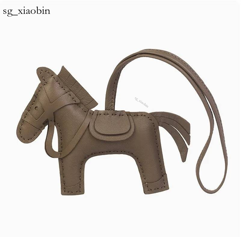 Mini sac tête de poney cousu à la main, pompon en cuir pour femmes, porte-clés pendentif, cadeau tendance