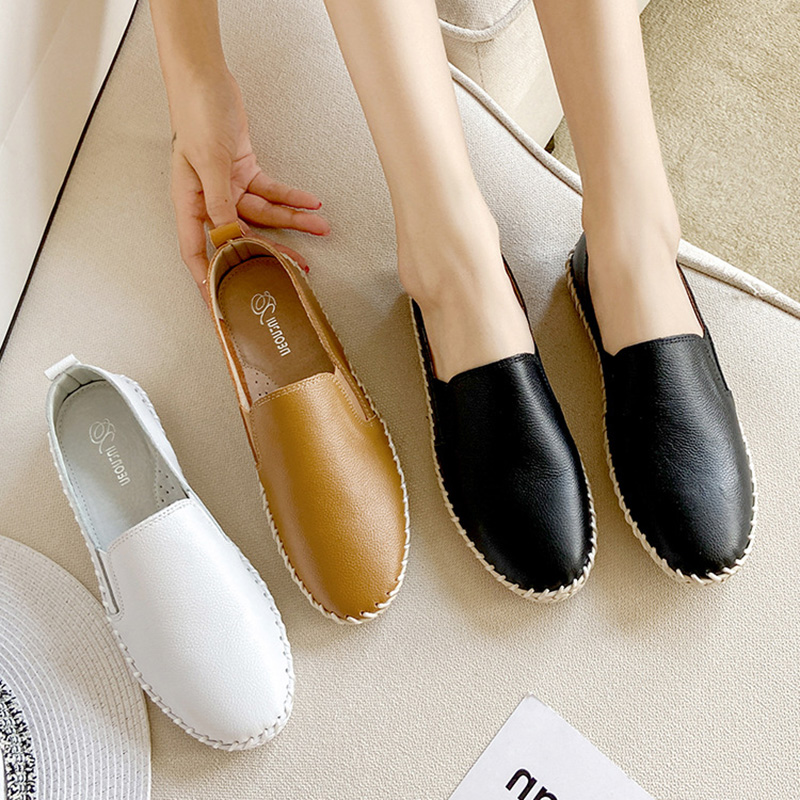 Petites chaussures en cuir blanches femme rond des appartements de cuir authentiques