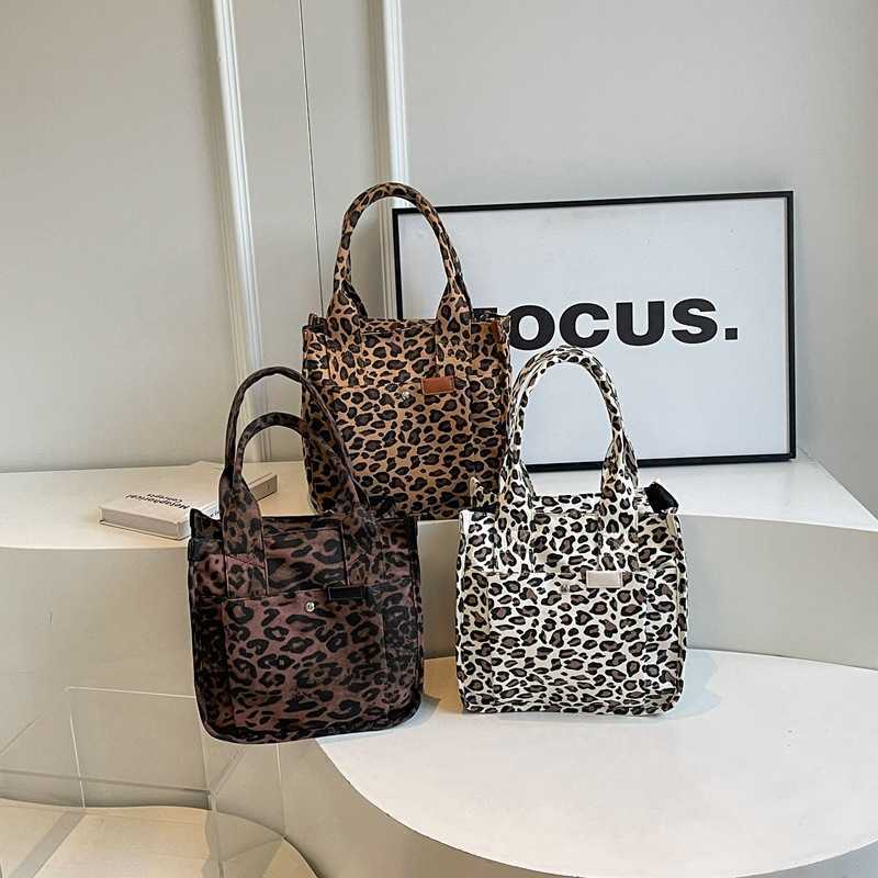 leopard print canvas handbag with large capacity and multiple pockets, fashionable and casual shopping armpit bag 240915