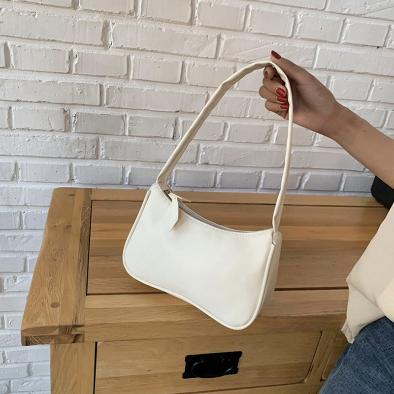 new model Retro forearm fashion bag women s bow wrap handbag PU trend leather baguette bag Western style single shoulder minimalist