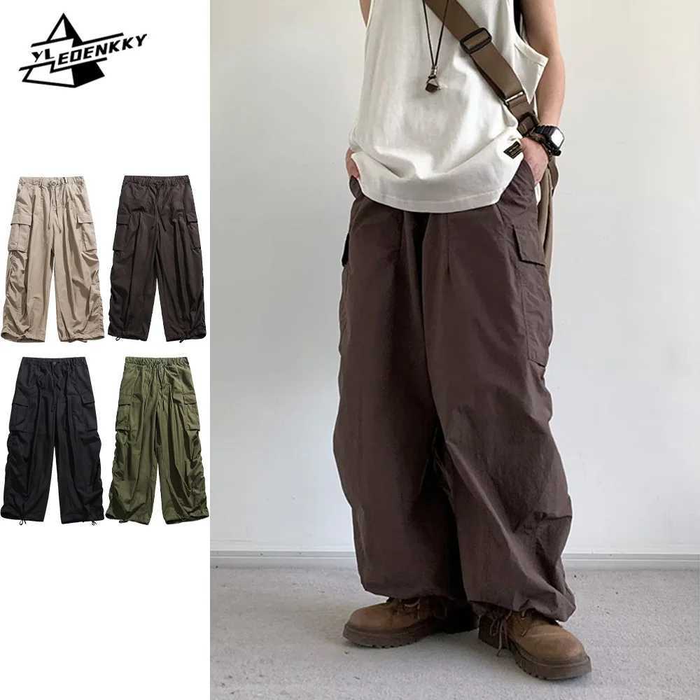 Pantalons de cargaison surdimensionnés pour hommes Hip-hop Femmes multi-poche pantalon de jambe rétro pantalon occasionnel en vrac couple de prin