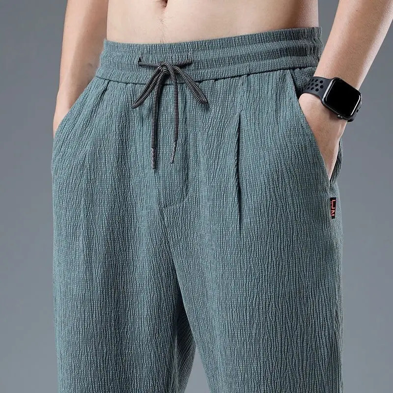 Spring and summer mens cotton and linen fabric ice silk long pants street clothing mens basic elastic waist loose sports casual pants240806