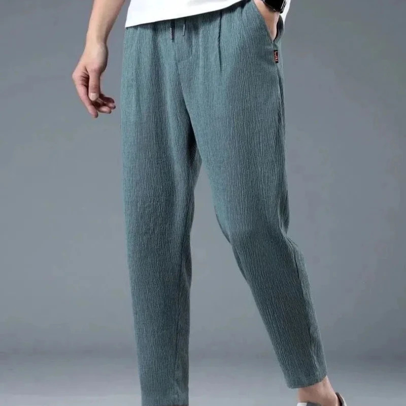 Spring and autumn cotton and linen rope solid color elastic mens clothing waist quick drying pocket drawstring simple thin straight pants240806
