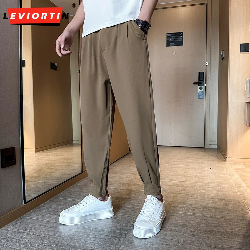 Vente décontractée de printemps et d'été de pantoufles à hommes colorés pantalon de soie de glace de style coréen beau glissière