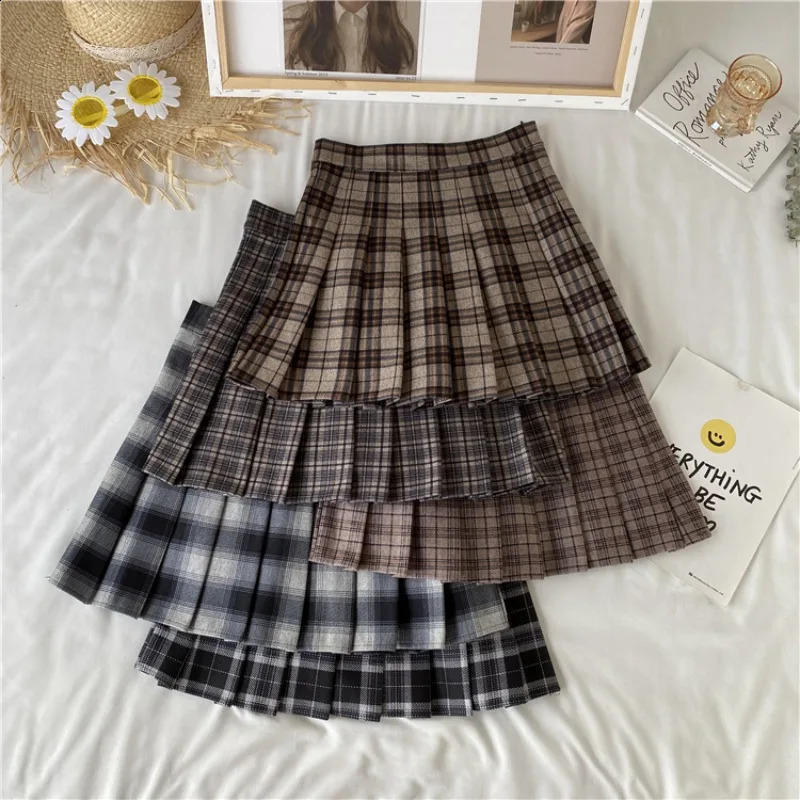 Jupe plissée à carreaux de style coréen femelle printemps et automne haute taille mince A-line courte jupe d'été en laine en laine 240809