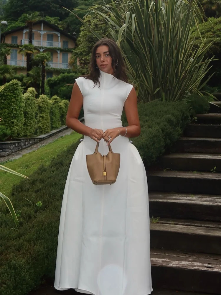 Élégant couleur solide cou rond robe longue mode sans manches irrégulières ourlet slim slim