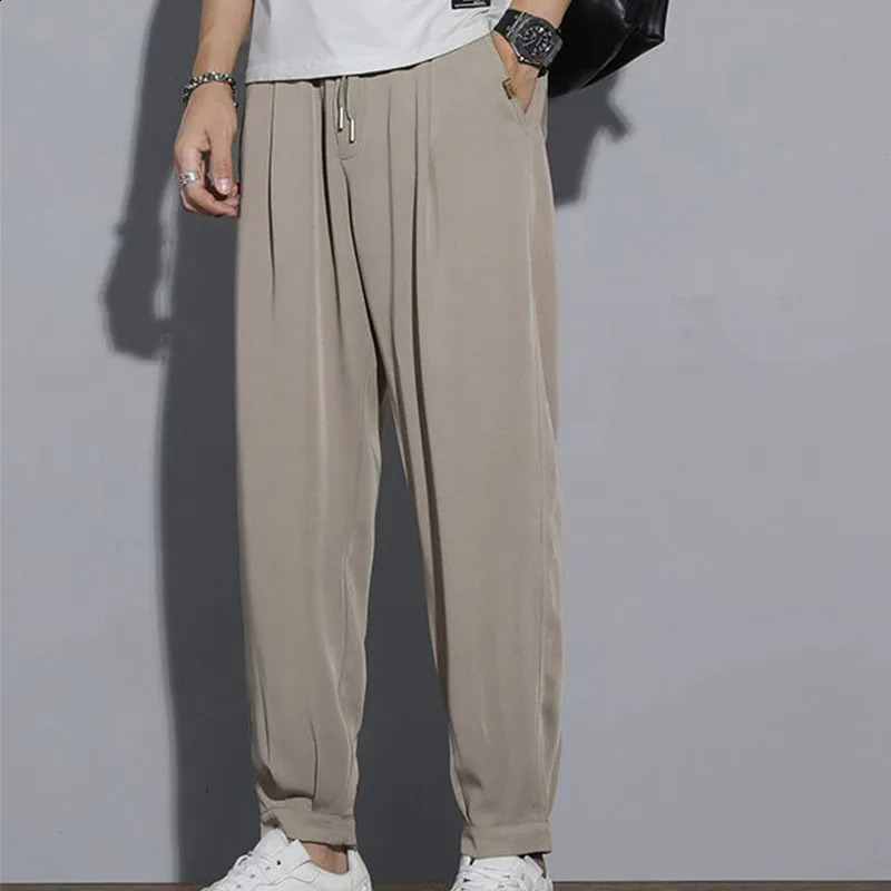Pantalon décontracté de style coréen printemps de style coréen harajuku pantalon lâche hommes surdimension des poches de couleur solide vêtements
