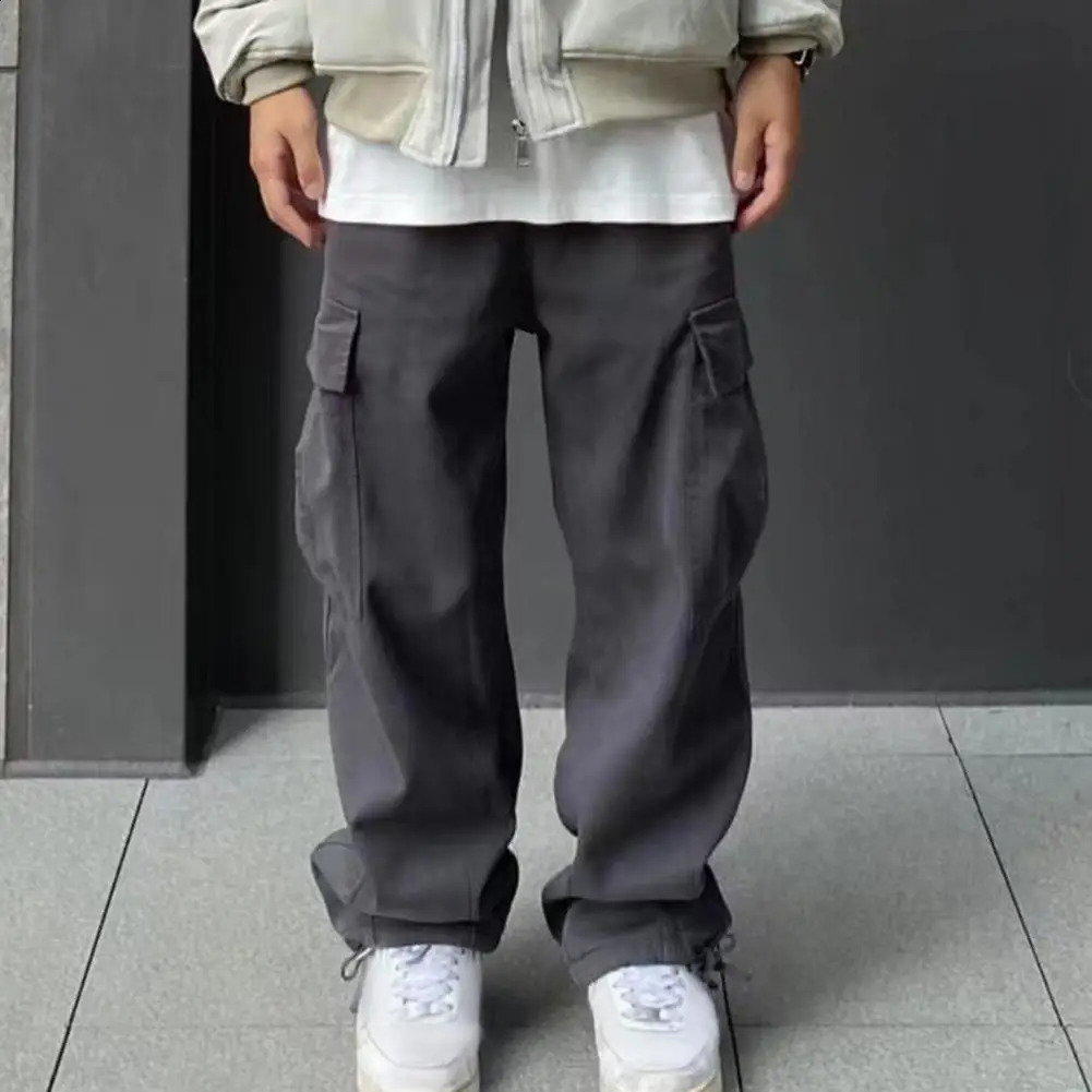 Pantalon de couleur un pantalon long pantalon de cargaison pour hommes de style rétro avec une taille élastique large multi-poches pour le confor