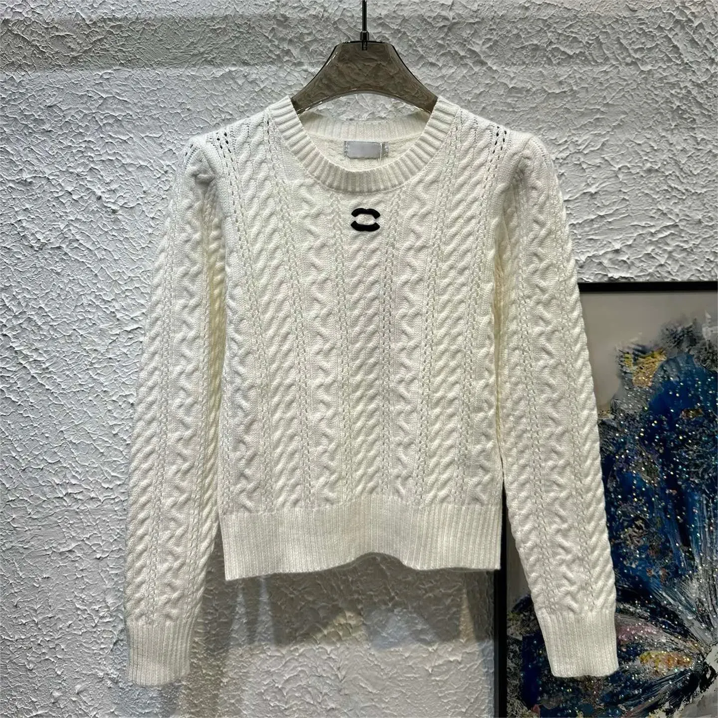 Pullage pour femmes automne à la mode à manches longues à manches à manches à manche à manche en tricot haut de gamme Haut-couche de créateur de