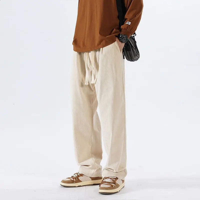 Édition de mode coréenne d'hiver Pantalon droit en velours côtelé pour hommes massifs solide poche de mode lâche sport