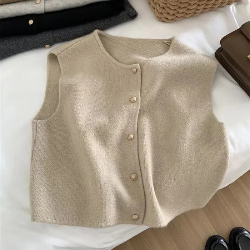 Bouton solide de printemps et automne en V V Veste de gilet ouvert sans manches en tricot et à la mode