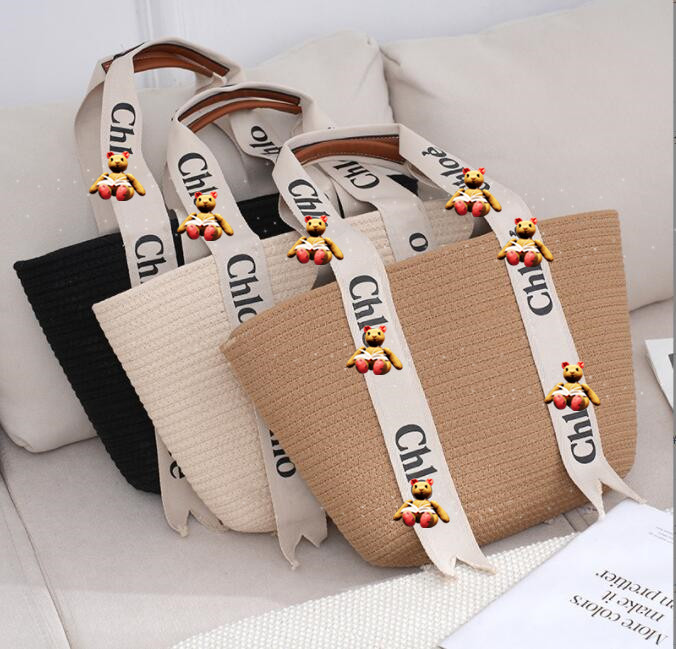Bagure tissé de paille de style de vacances à chaud 2022 Nouveau sac portable tissé de loisirs à haute capacité d'été pour sac à main de la plage