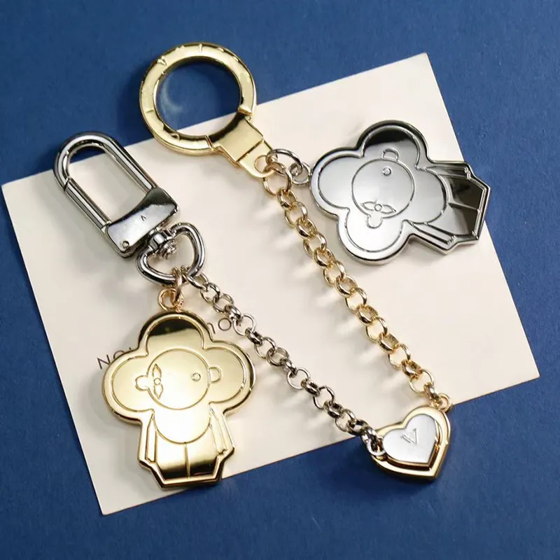 s Heart Keychains Fashion Lanyards Designer Magnetic Buckle Keychain Brand Letter Chain Womens Bag Charm Two Dolls Pendant Men Car Key Ring X250125