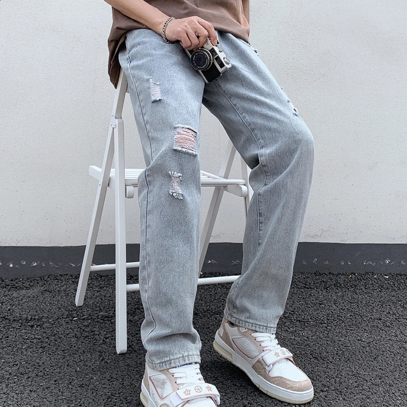 Jeans déchirés en denim en ruine des hommes de genou et pantalon décontracté à bleu clair