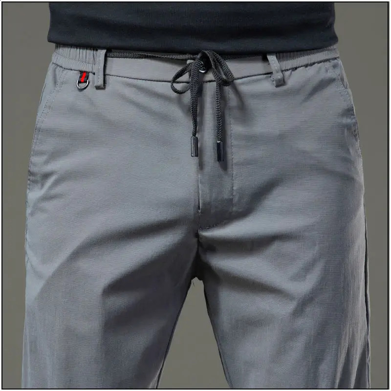 Spring and autumn loose solid mens clothing elastic waist pocket Chaopai Drawstring quick drying casual straight pants 240724