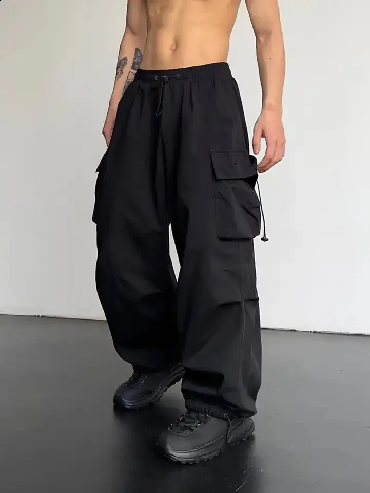 Pandes décontractées de mode de printemps pour hommes Streetwear Couleur solide pantalon de cargaison élastique