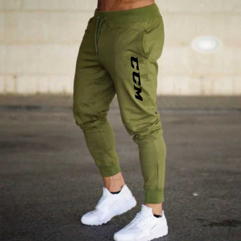 Pantalon masculin 2024 Nouveau pantalon imprimé automne ccm hommes / femmes Pantalons de course joggeurs de pantalon de survêtement Sport Sport C