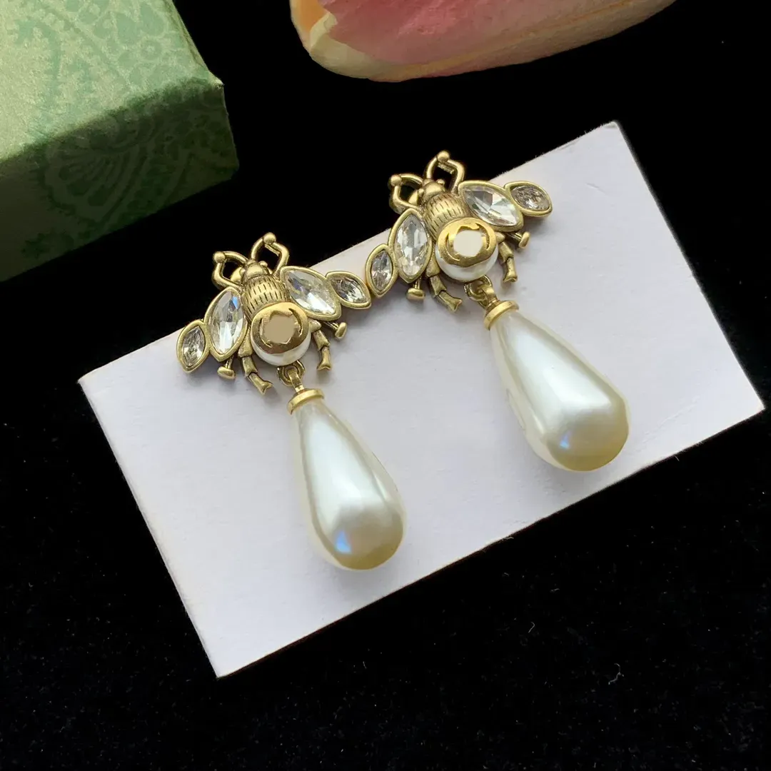 Luxury designer little bee white resin pendant earrings women's fashion and exquisite Charm earrings women's wedding party gift jewelry-image-969588207