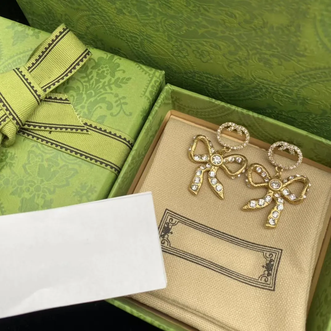 2024 Luxury designer Diamond Bow Charm Earrings Women's Fashion and Exquisite Pendant Earrings Bonatos Material for Wedding Party Christmas-image-991548933