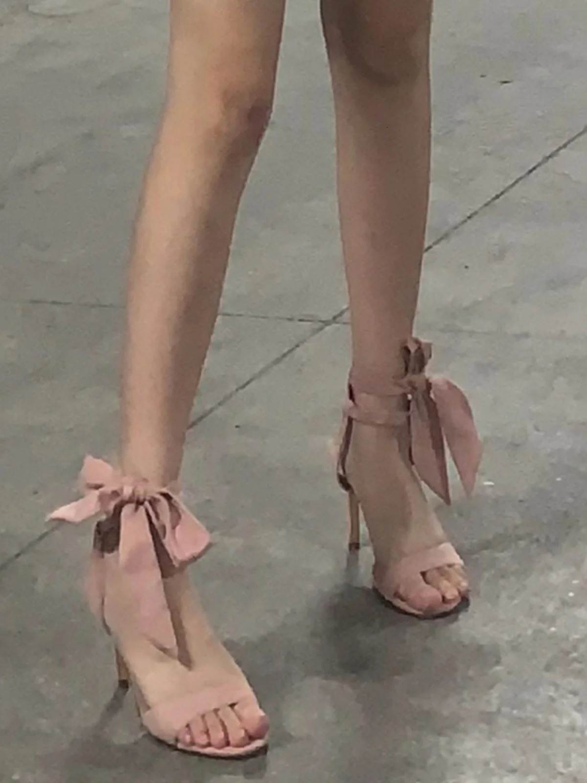 Strap sandals for womens summer style with a stunning pink color paired with a skirt with a straight line and high heels 240621