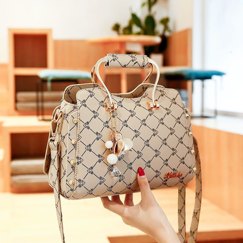 Nouveau modèle Nouveau épaule à la mode à la mode coréenne Version tendance enveloppe simple sac à bandoulière multifonctionnel grand sac de lois