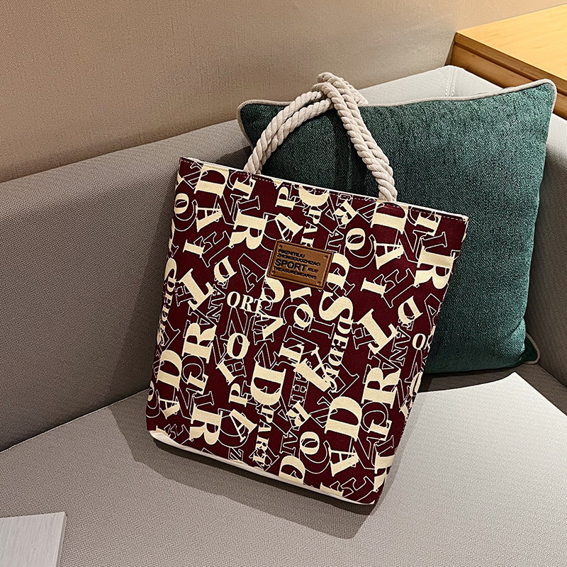 Nouveau modèle Tendance Canvas Grande capacité enveloppe de lettre de shopping extérieure imprimé Single Handbag épaule coréenne Version de loisi