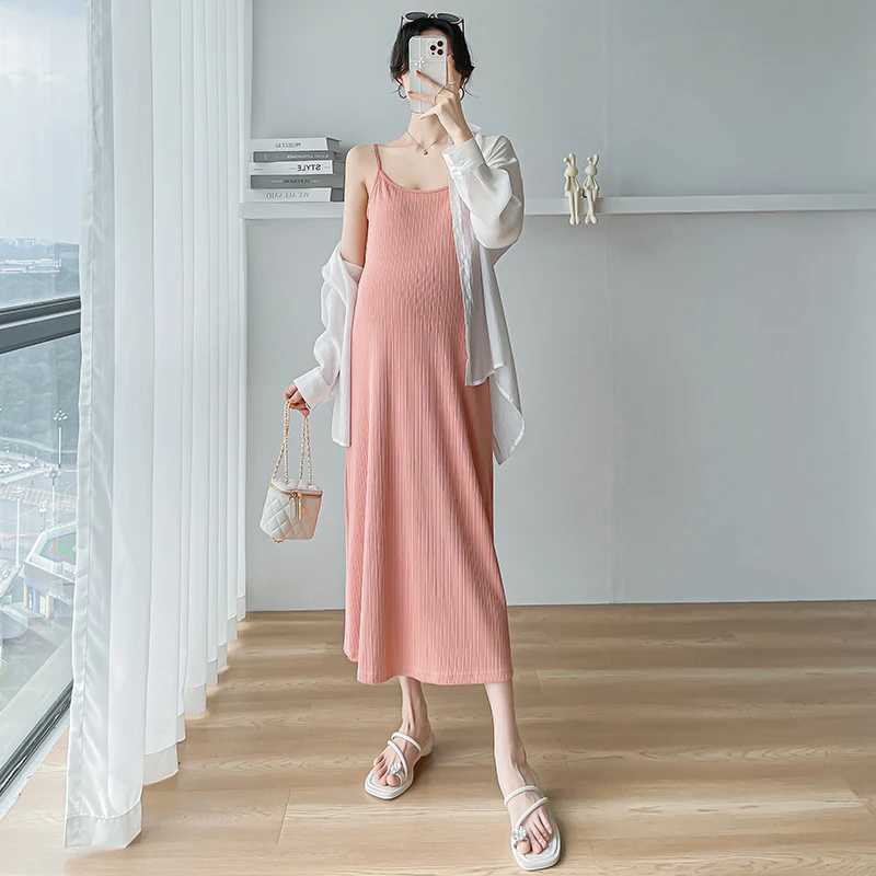 2024 Robe de sangle de maternité d'été Couleur solide sans manches enceintes femme de plage de mode longue